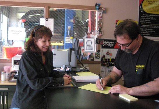 Meineke customer and Asst. Manager, Tom Lutz